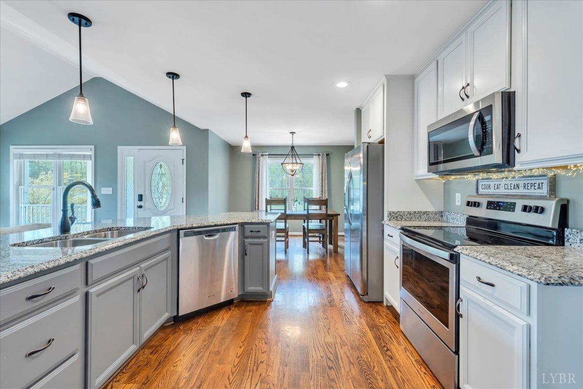 1400 Mountain Cut Road Appomattox, VA 24522 - Photo 4 of 55 a large kitchen with stainless steel appliances granite countertop a stove a sink dishwasher and a refrigerator with wooden floor