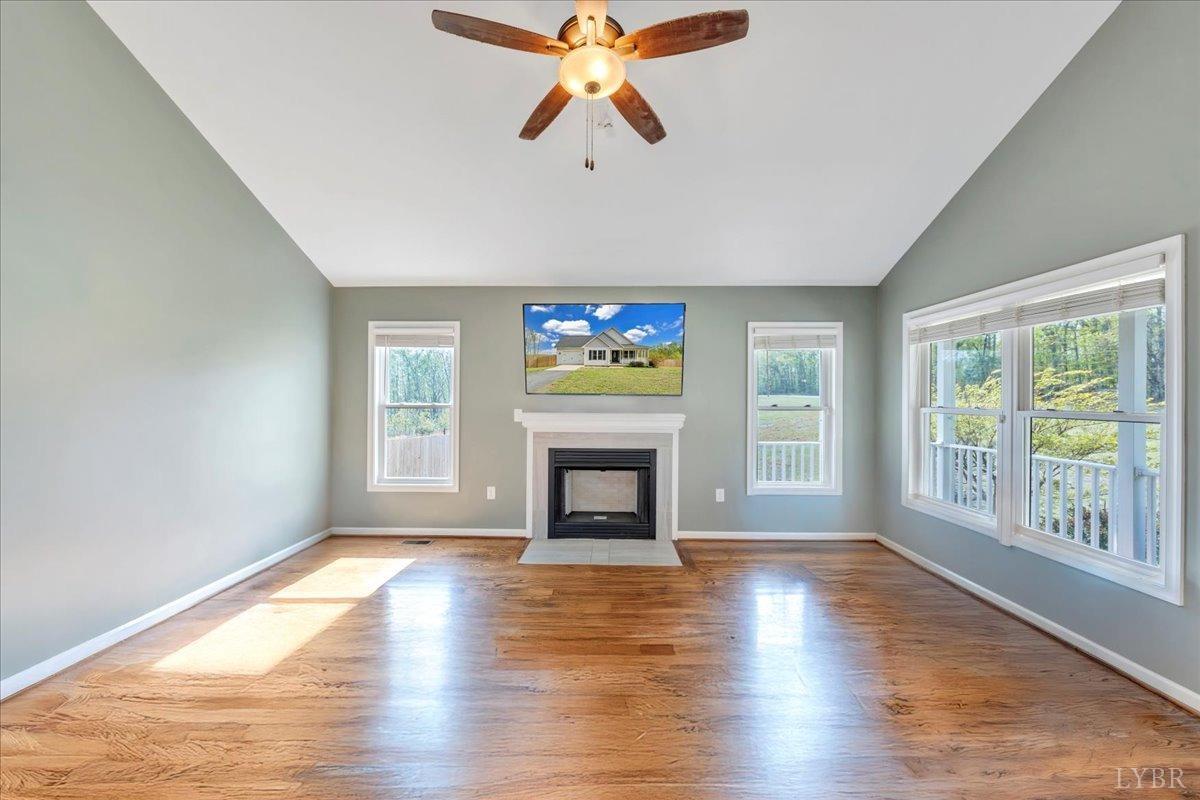 1400 Mountain Cut Road Appomattox, VA 24522 - Photo 7 of 55 wooden floor fireplace and windows in an empty room