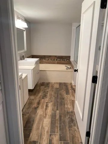 a bathroom with a sink and a mirror