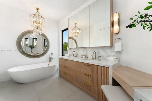 a bathroom with a sink mirror and vanity