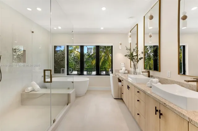 a large bathroom with a large tub and sink