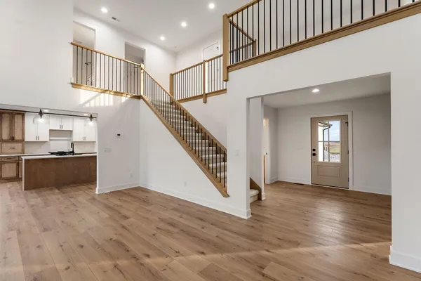 an empty room with wooden floor