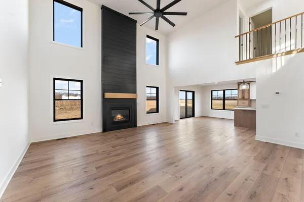 a view of livingroom with hardwood floor and a ceiling fan