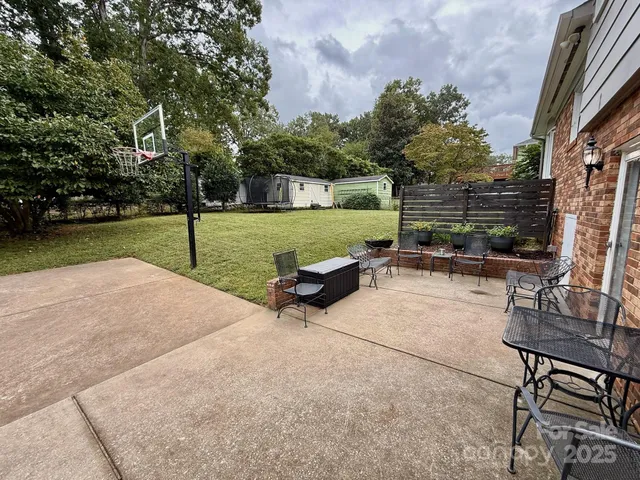 a view of a garden with furniture