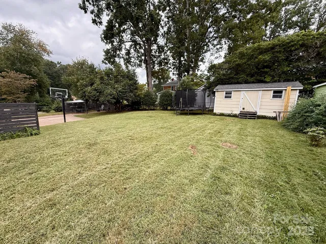 a house with trees in the background