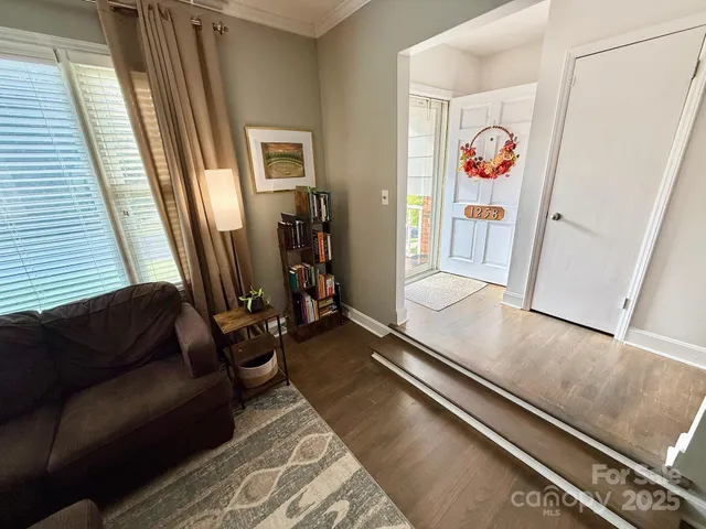 a living room with a couch and a window