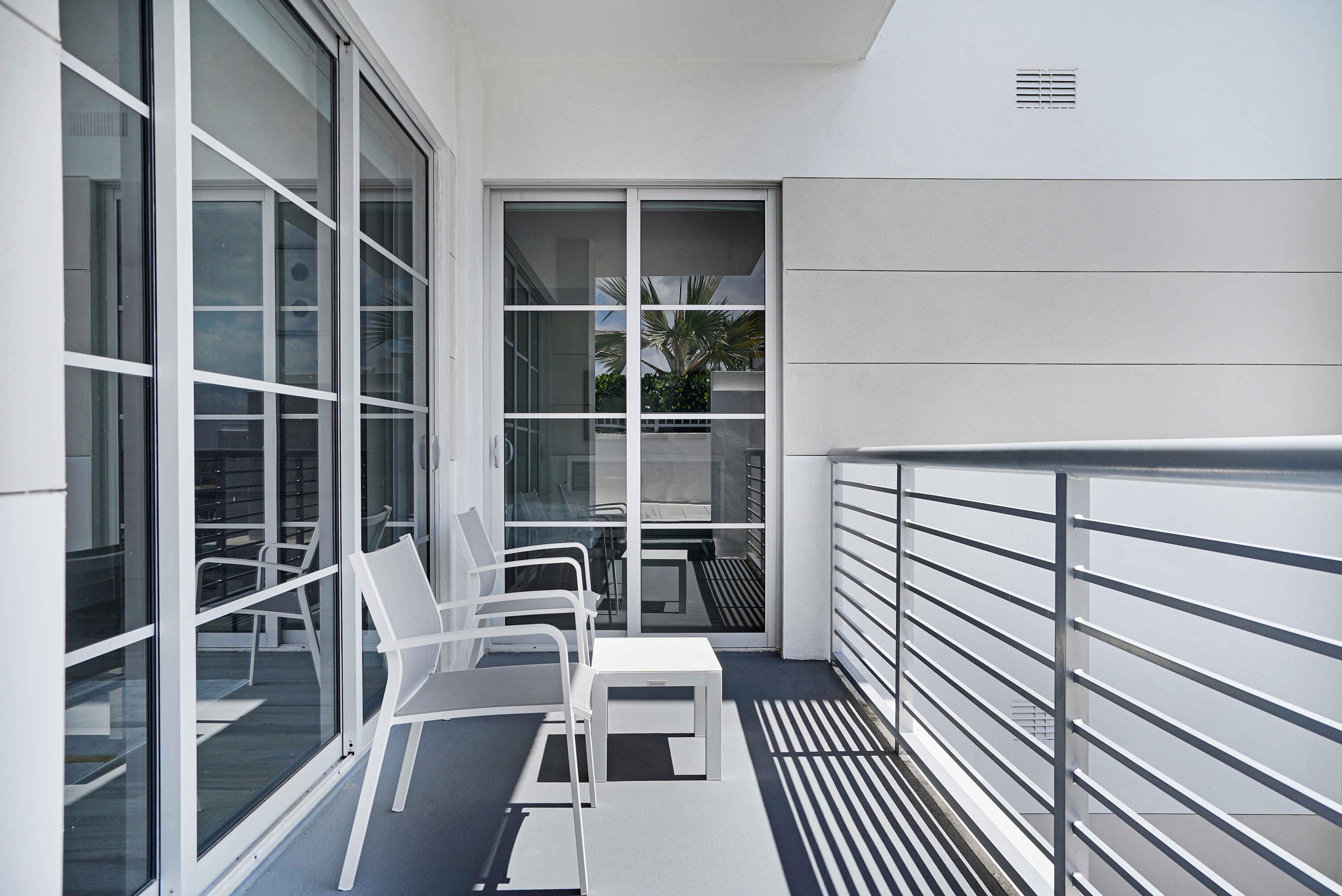 155 East Boca Raton Road, Unit 916 Boca Raton, FL 33432 - Photo 33 of 72 a view of a balcony with wooden floor and a window