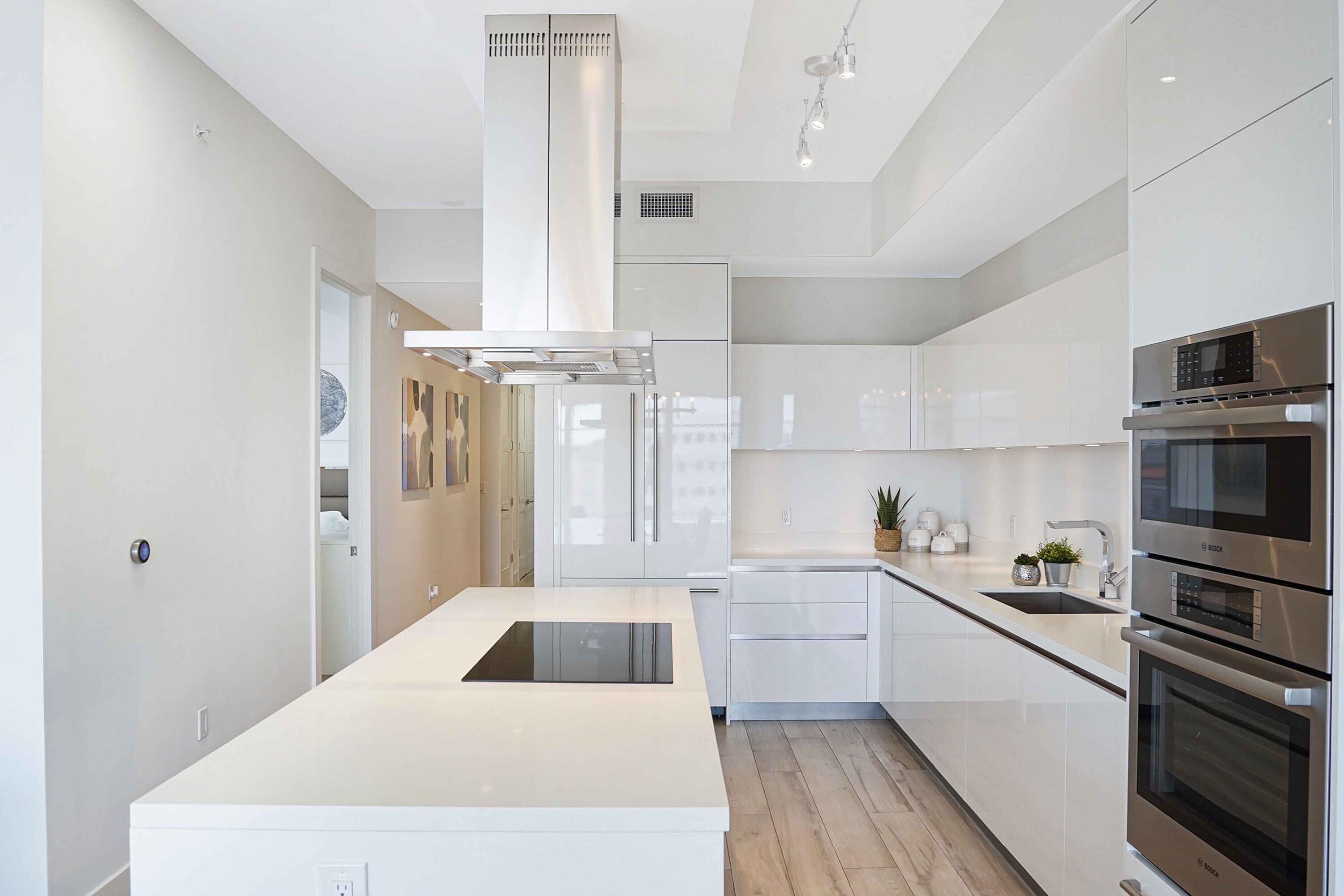 155 East Boca Raton Road, Unit 916 Boca Raton, FL 33432 - Photo 39 of 72 a kitchen with cabinets and stainless steel appliances