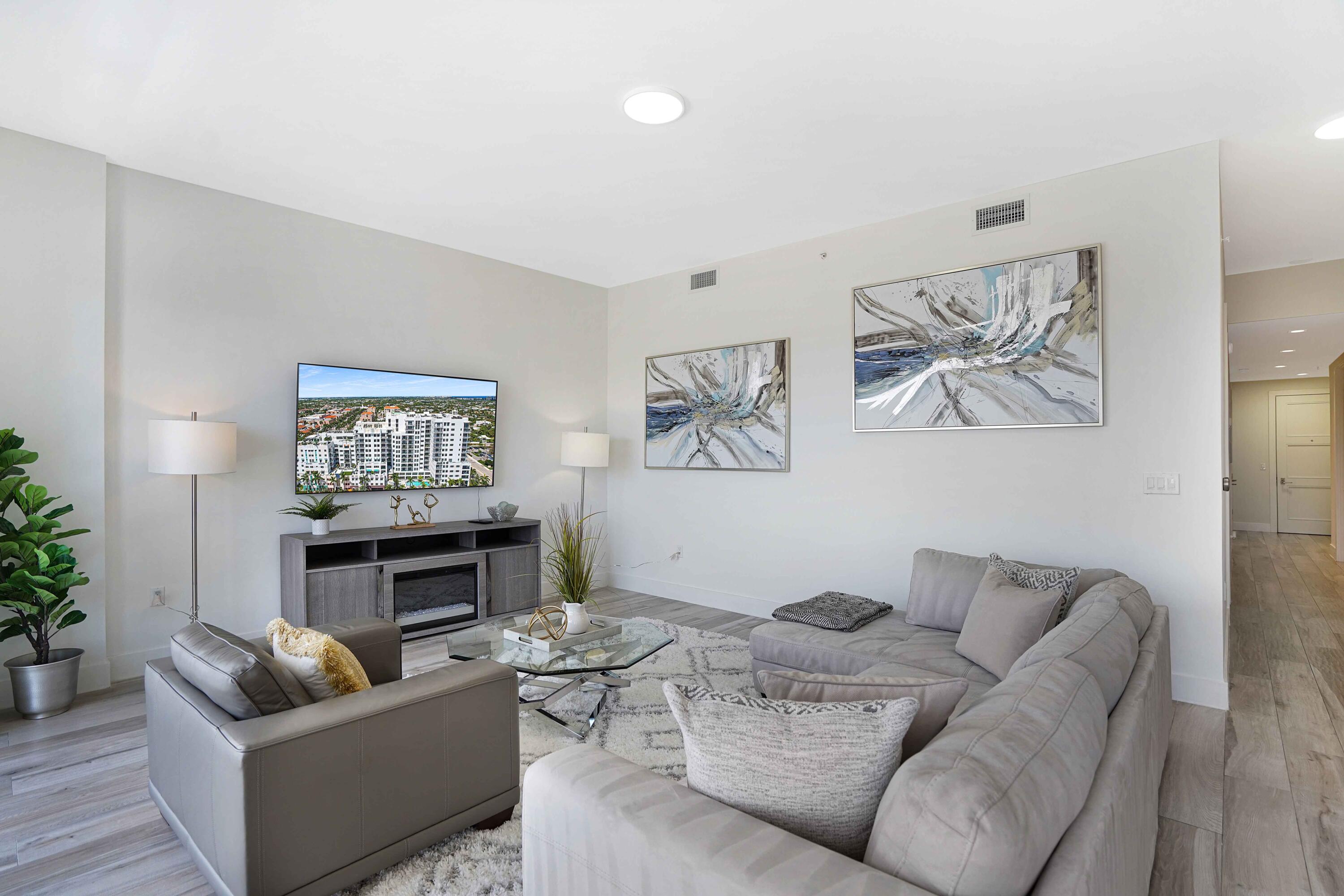 155 East Boca Raton Road, Unit 916 Boca Raton, FL 33432 - Photo 44 of 72 a living room with furniture and a fireplace