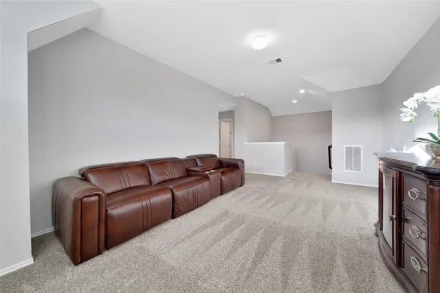 a living room with a couch and a fireplace