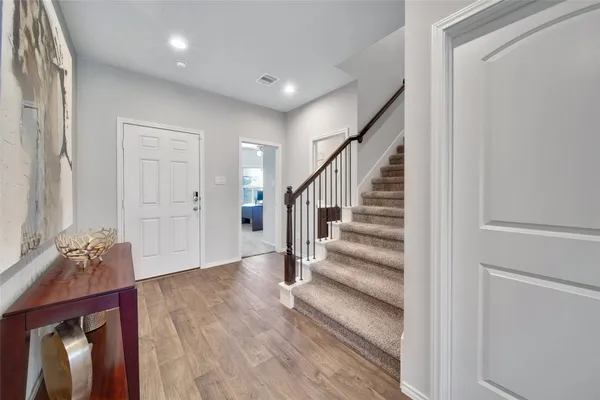 a view of entryway with wooden floor