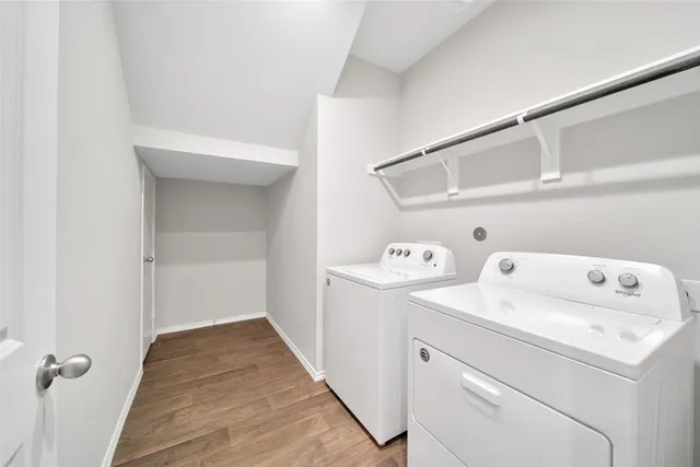 a view of storage and utility room with washer and dryer