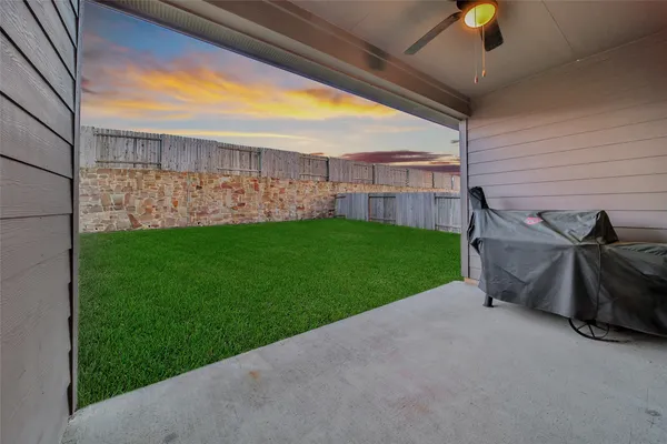a view of a backyard with hardwood