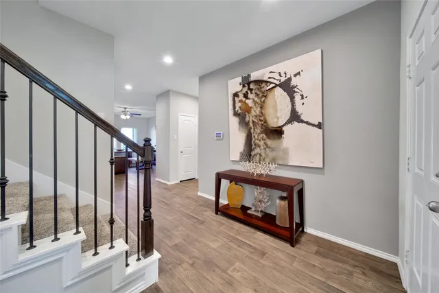 a view of an entryway with wooden floor
