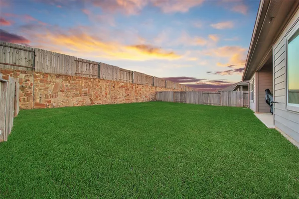 a view of a garden with a small cabin