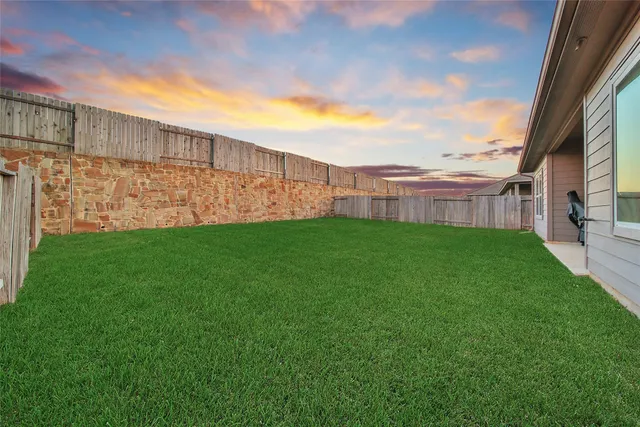 a view of a garden with a small cabin