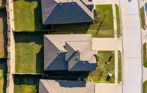 an aerial view of a house with a swimming pool