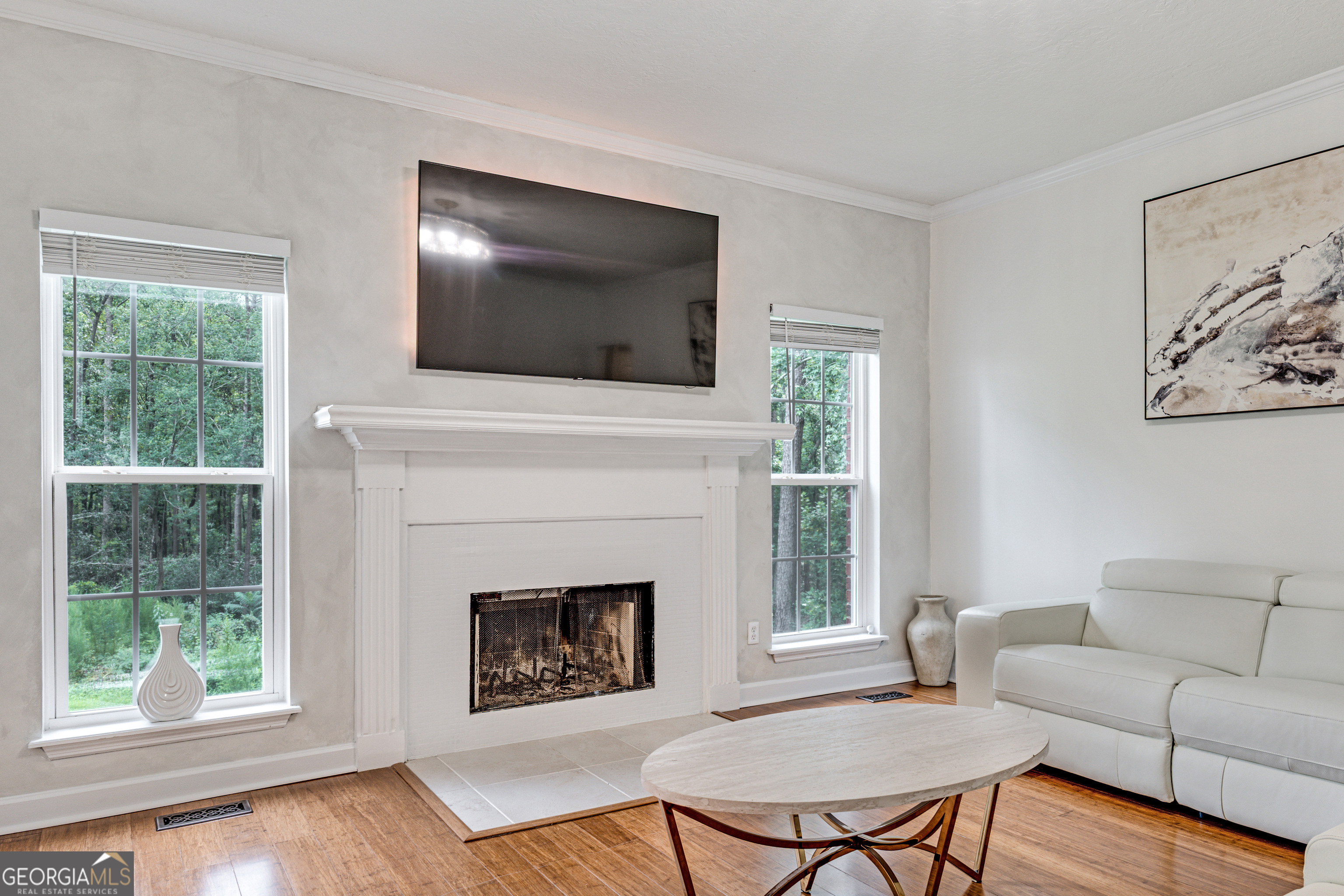 2535 Sand Ridge Court Hephzibah, GA 30815 - Photo 20 of 41 a living room with furniture a flat screen tv and a fireplace