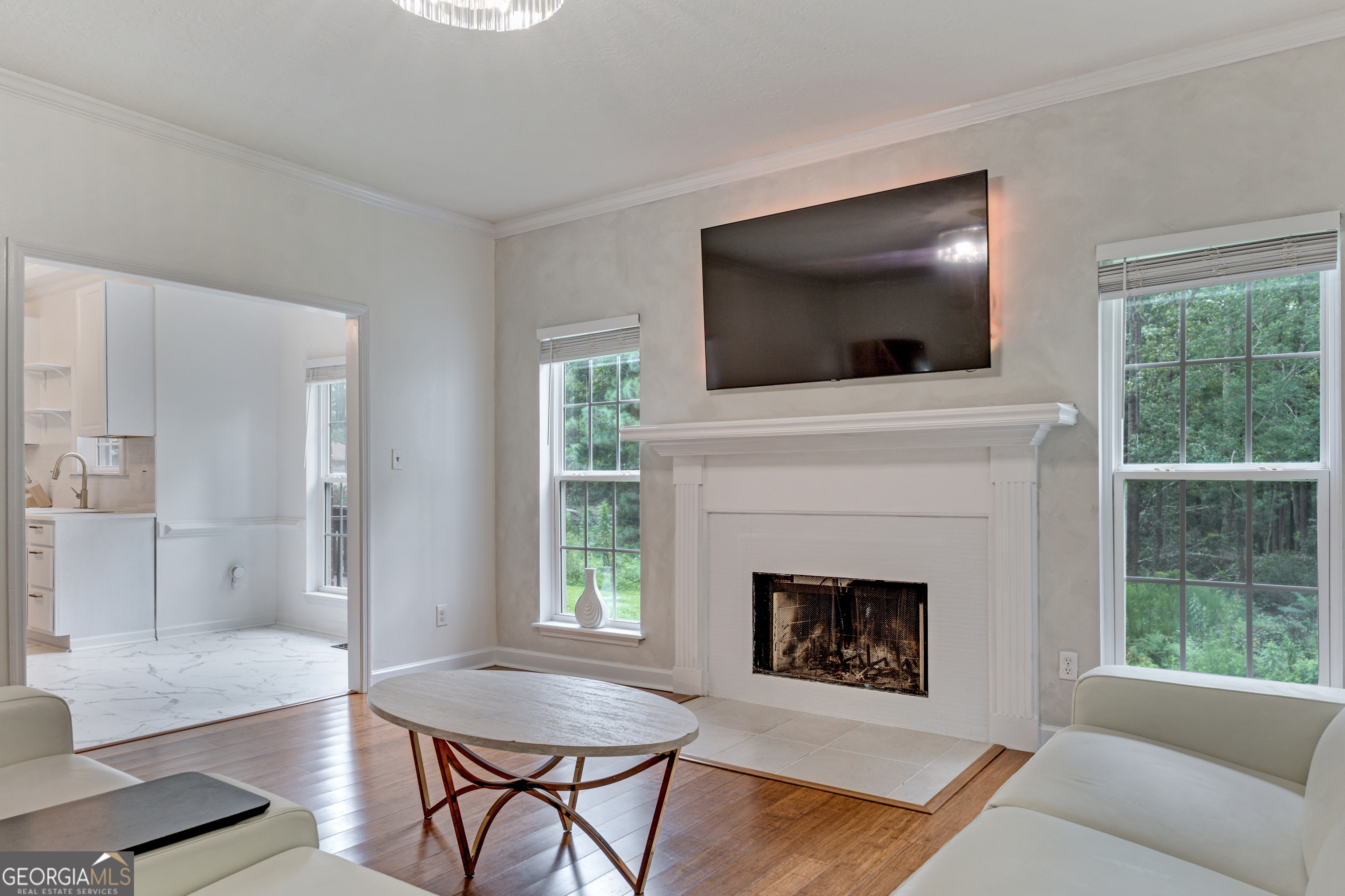2535 Sand Ridge Court Hephzibah, GA 30815 - Photo 22 of 41 a living room with furniture a flat screen tv and a fireplace