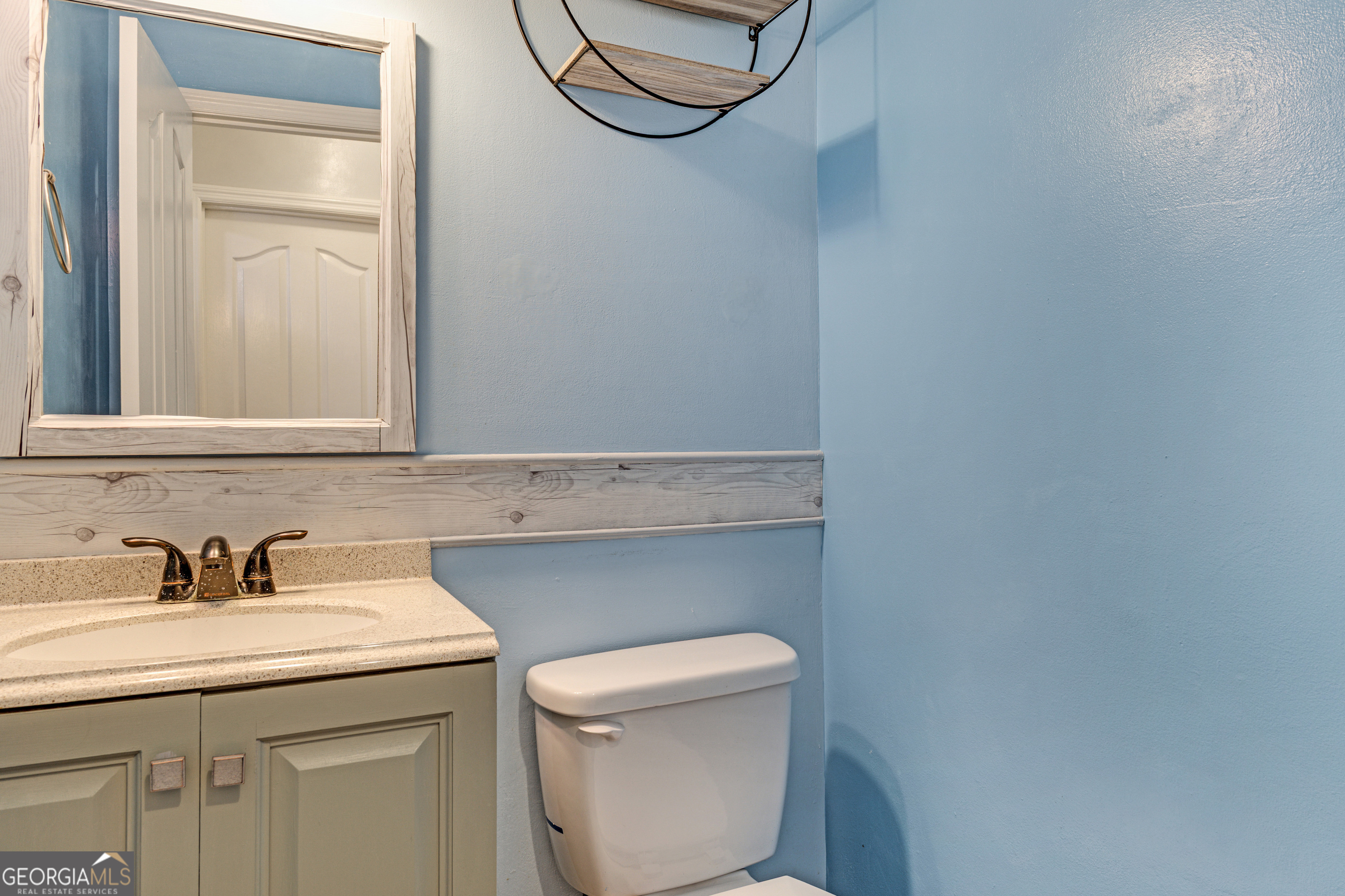 2535 Sand Ridge Court Hephzibah, GA 30815 - Photo 24 of 41 a bathroom with a toilet a sink and mirror