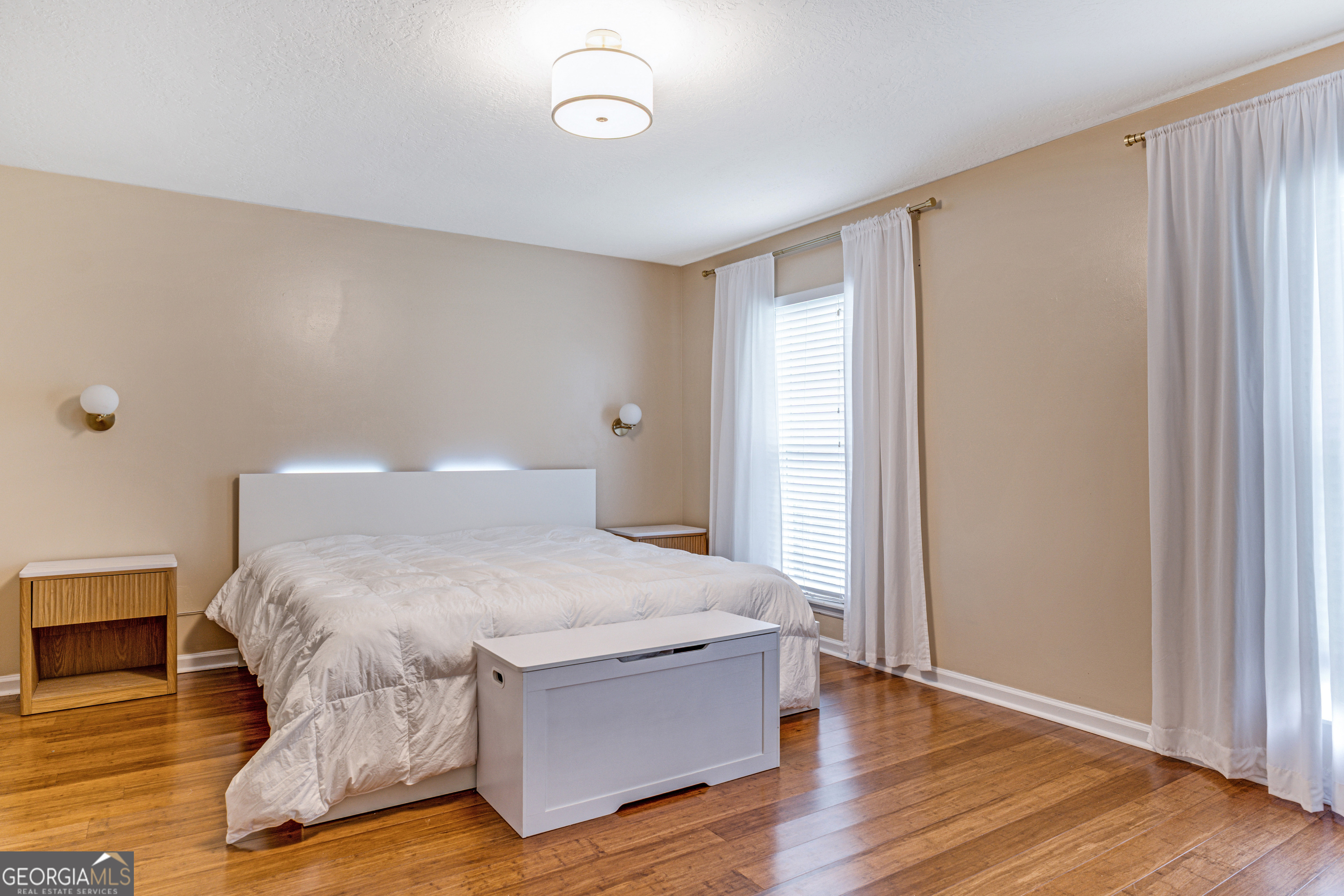 2535 Sand Ridge Court Hephzibah, GA 30815 - Photo 25 of 41 a spacious bedroom with a bed and wooden floor