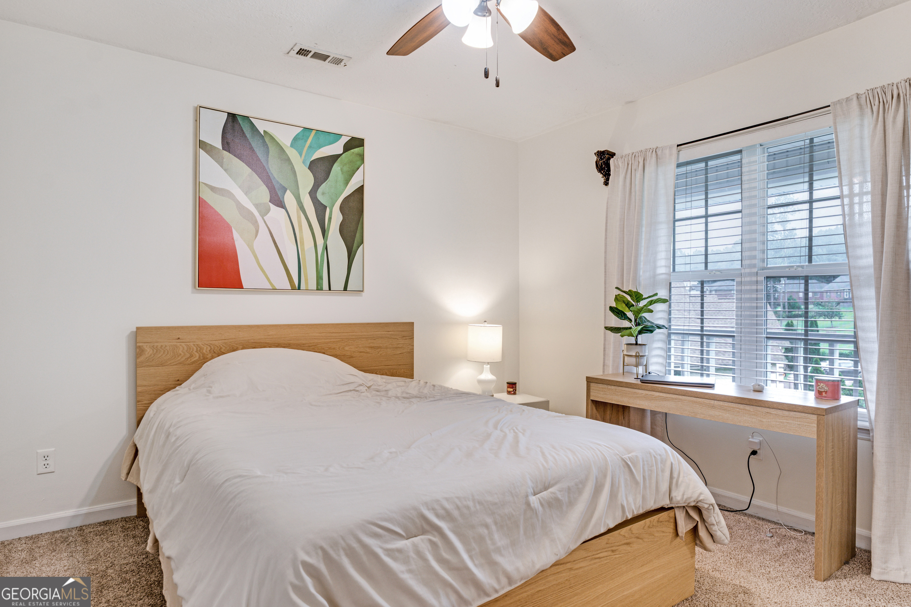 2535 Sand Ridge Court Hephzibah, GA 30815 - Photo 33 of 41 a bedroom with a bed and a large window