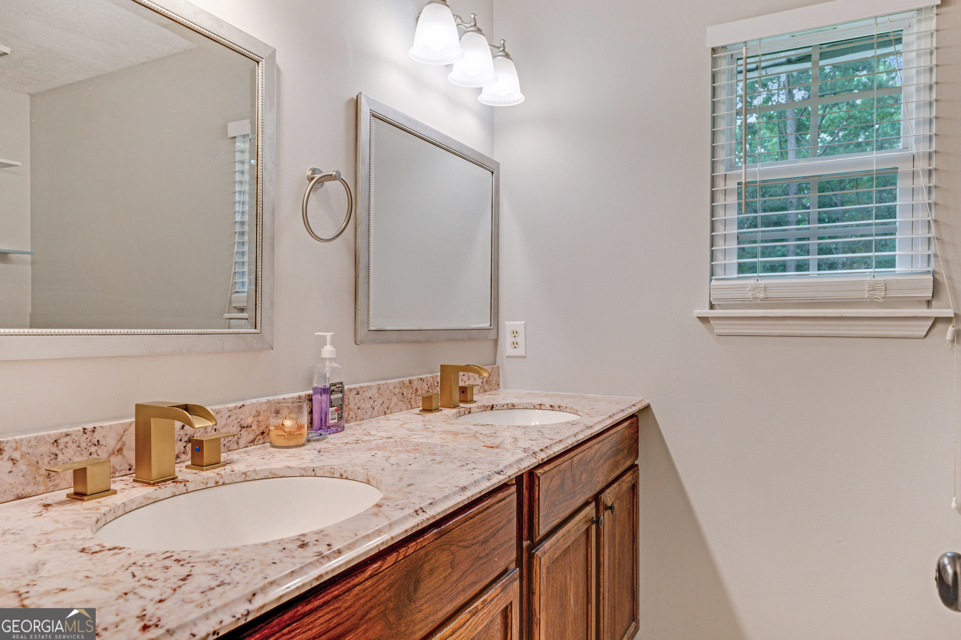 2535 Sand Ridge Court Hephzibah, GA 30815 - Photo 40 of 41 a bathroom with a granite countertop sink a large mirror and a window