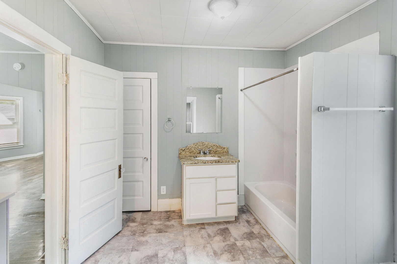 705 Nicholson Street Joliet, IL 60435 - Photo 13 of 26 a bathroom with a bathtub and shower