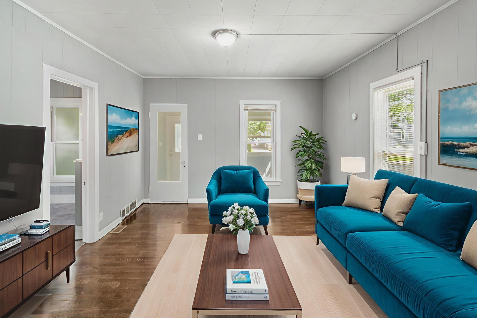 705 Nicholson Street Joliet, IL 60435 - Photo 2 of 26 a living room with furniture and a flat screen tv