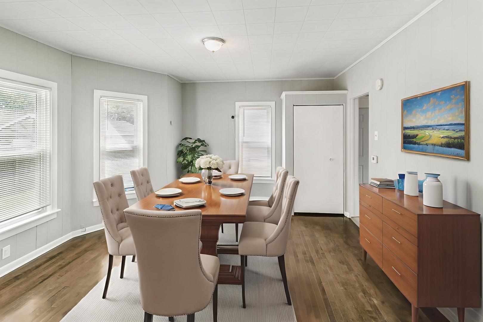 705 Nicholson Street Joliet, IL 60435 - Photo 4 of 26 a view of a dining room with furniture window and wooden floor