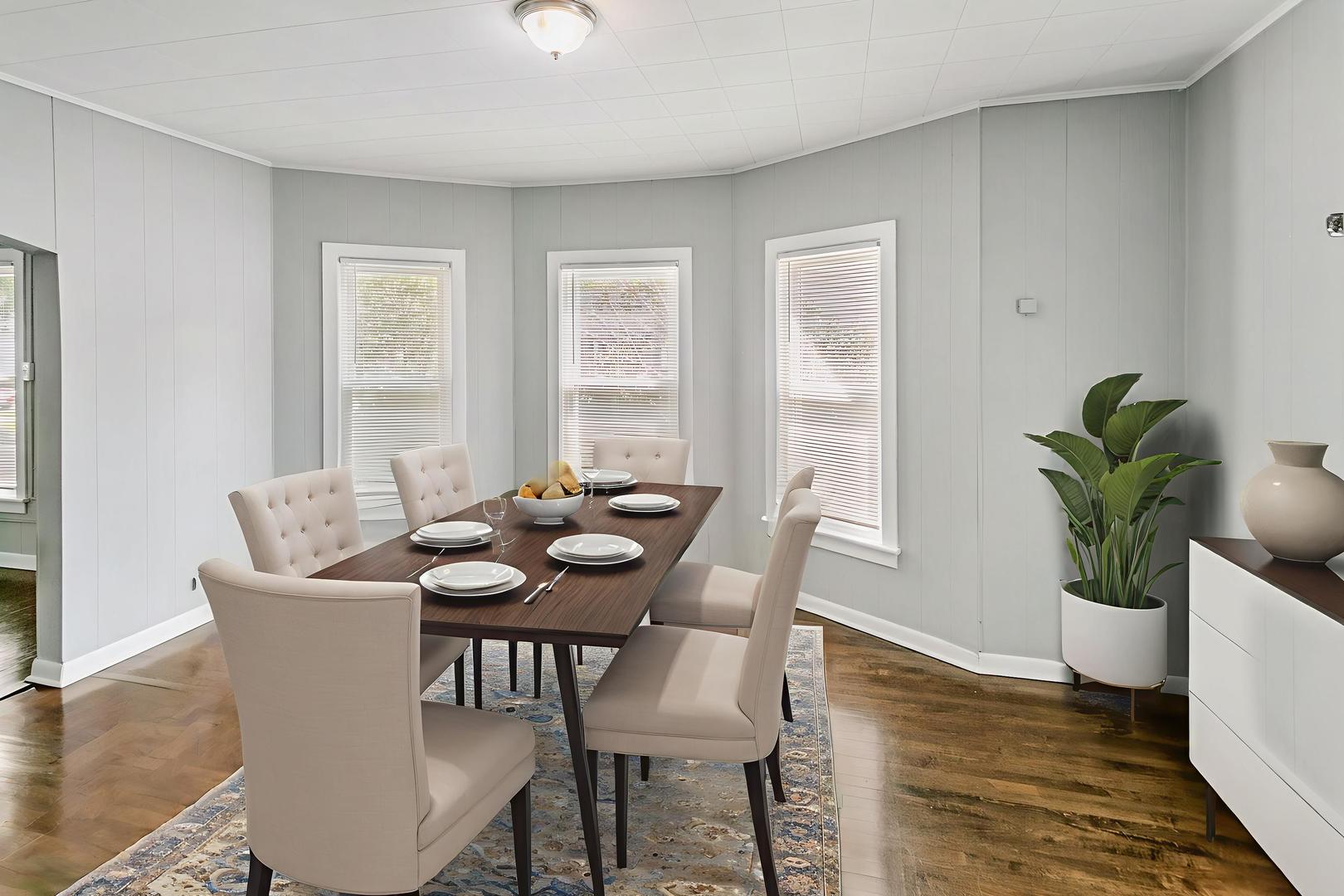 705 Nicholson Street Joliet, IL 60435 - Photo 5 of 26 a view of a dining room with furniture window and wooden floor