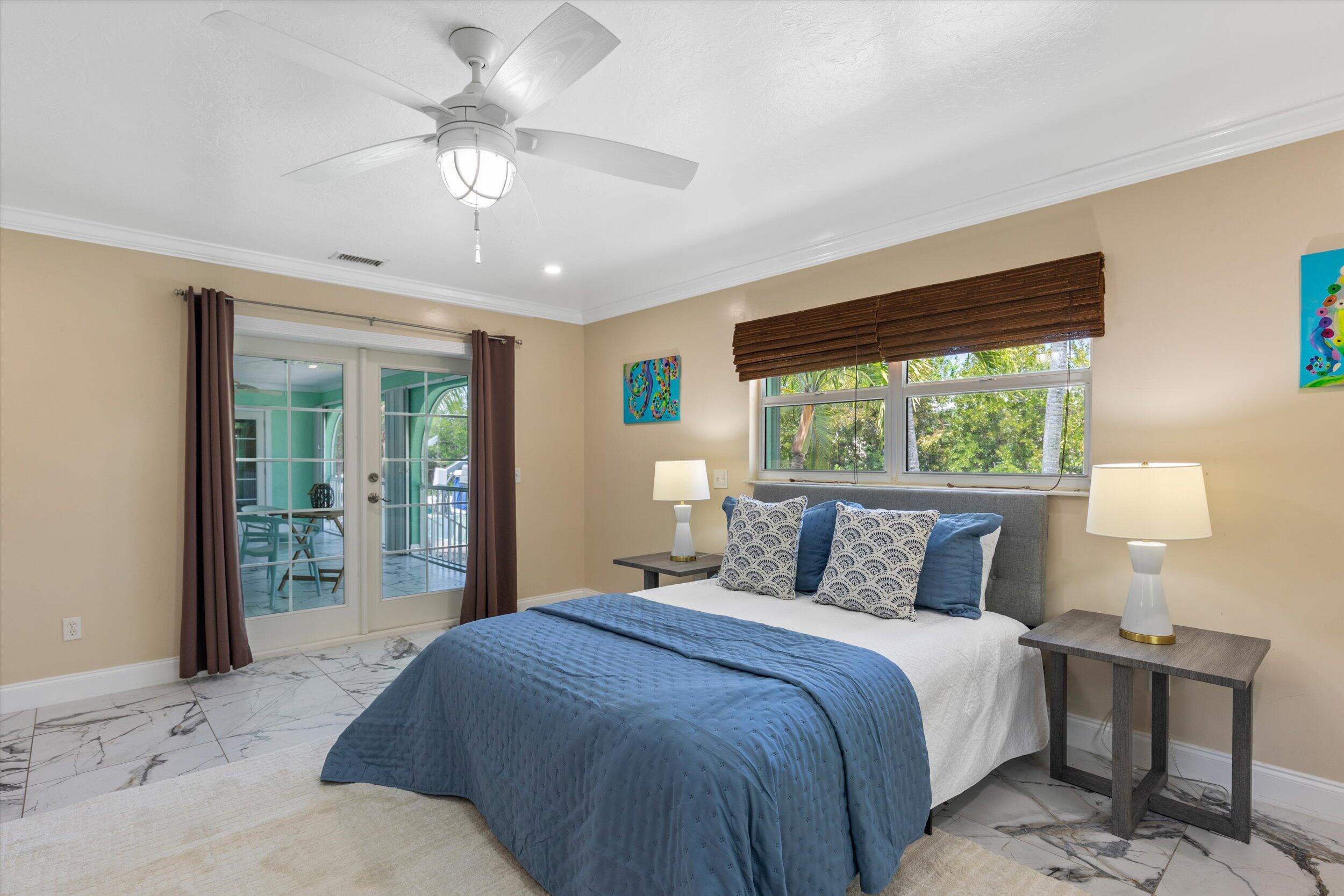 21025 3rd Avenue Cudjoe, FL 33042 - Photo 17 of 43 a bedroom with a large bed and a window