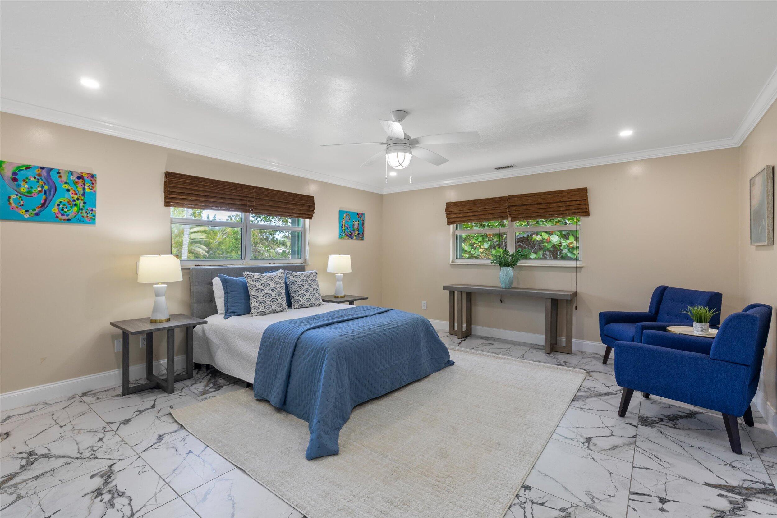 21025 3rd Avenue Cudjoe, FL 33042 - Photo 18 of 43 a bed room with a bed and a chair