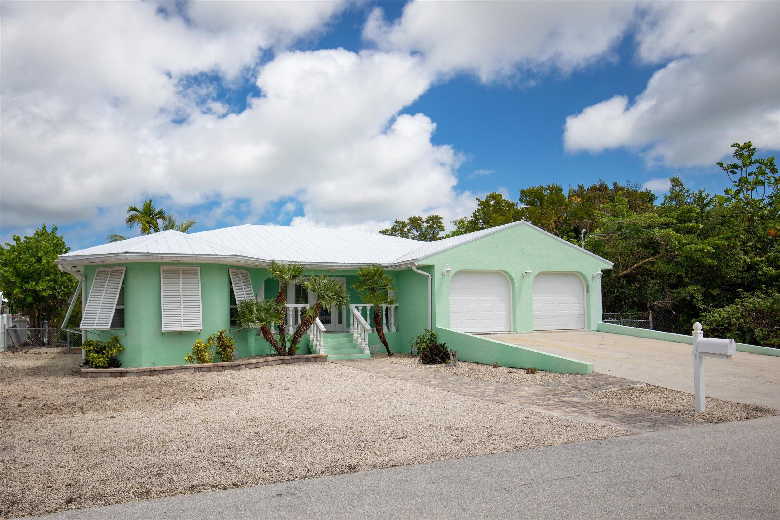 21025 3rd Avenue Cudjoe, FL 33042 - Photo 2 of 43 a view of a house with a yard and plants