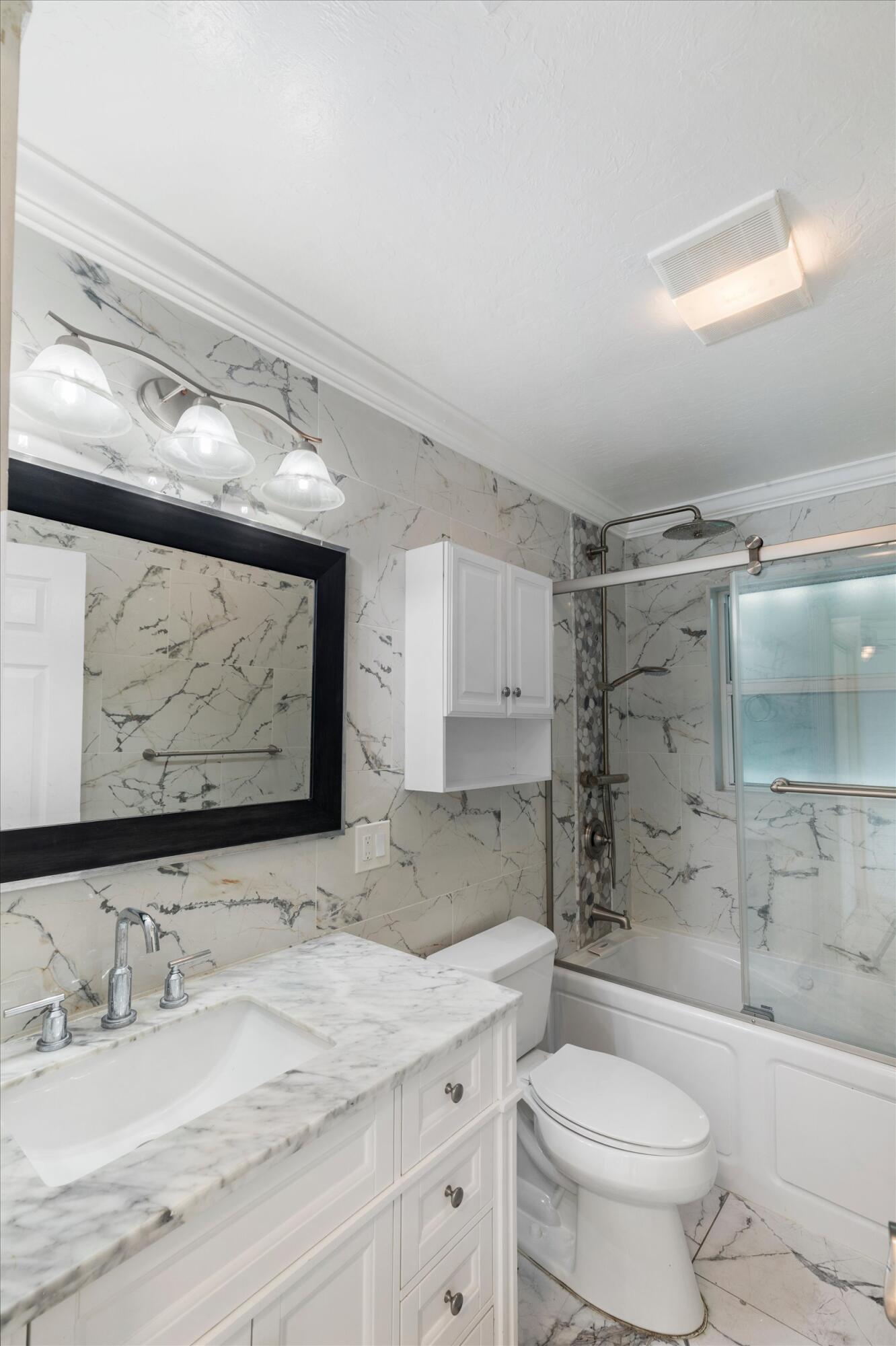 21025 3rd Avenue Cudjoe, FL 33042 - Photo 24 of 43 a bathroom with a sink toilet and shower