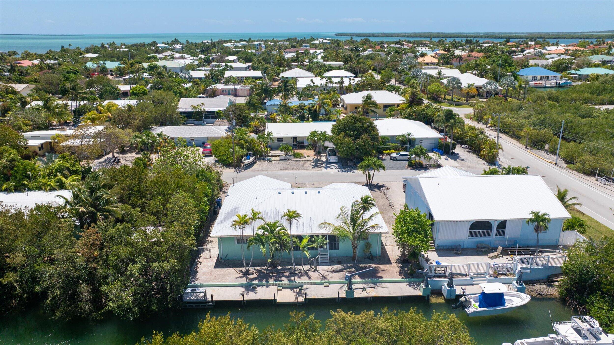 21025 3rd Avenue Cudjoe, FL 33042 - Photo 28 of 43 an aerial view of house with yard swimming pool and outdoor seating