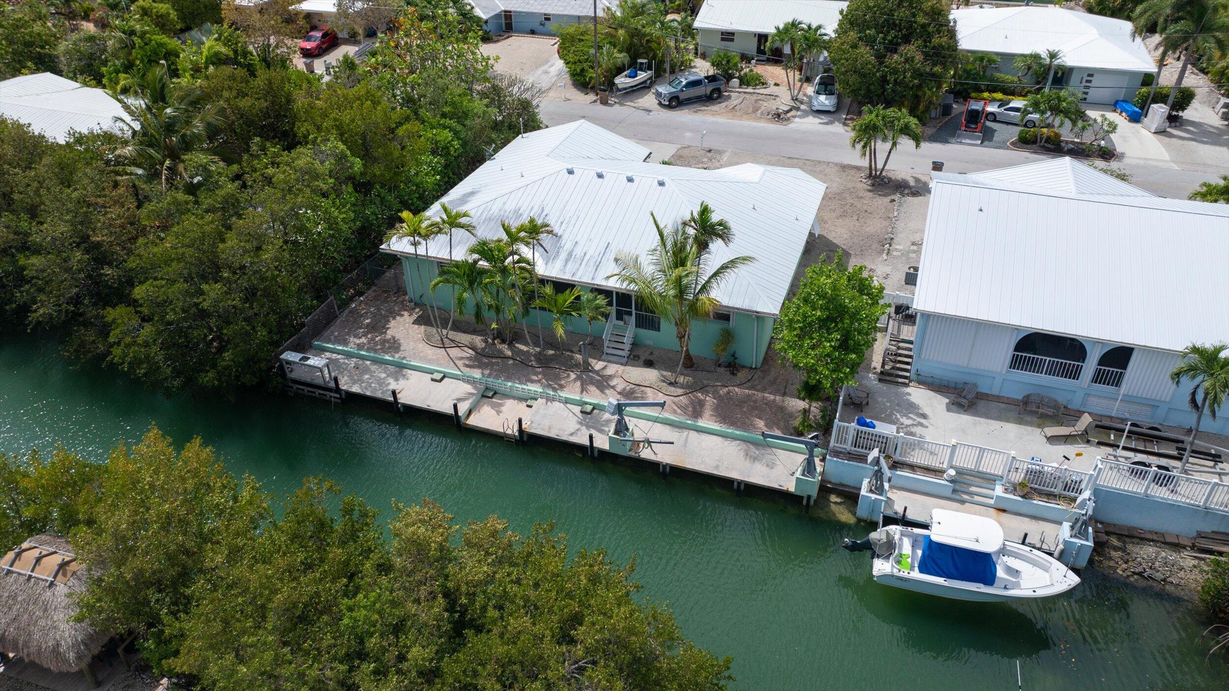 21025 3rd Avenue Cudjoe, FL 33042 - Photo 32 of 43 an aerial view of a house with swimming pool and outdoor space