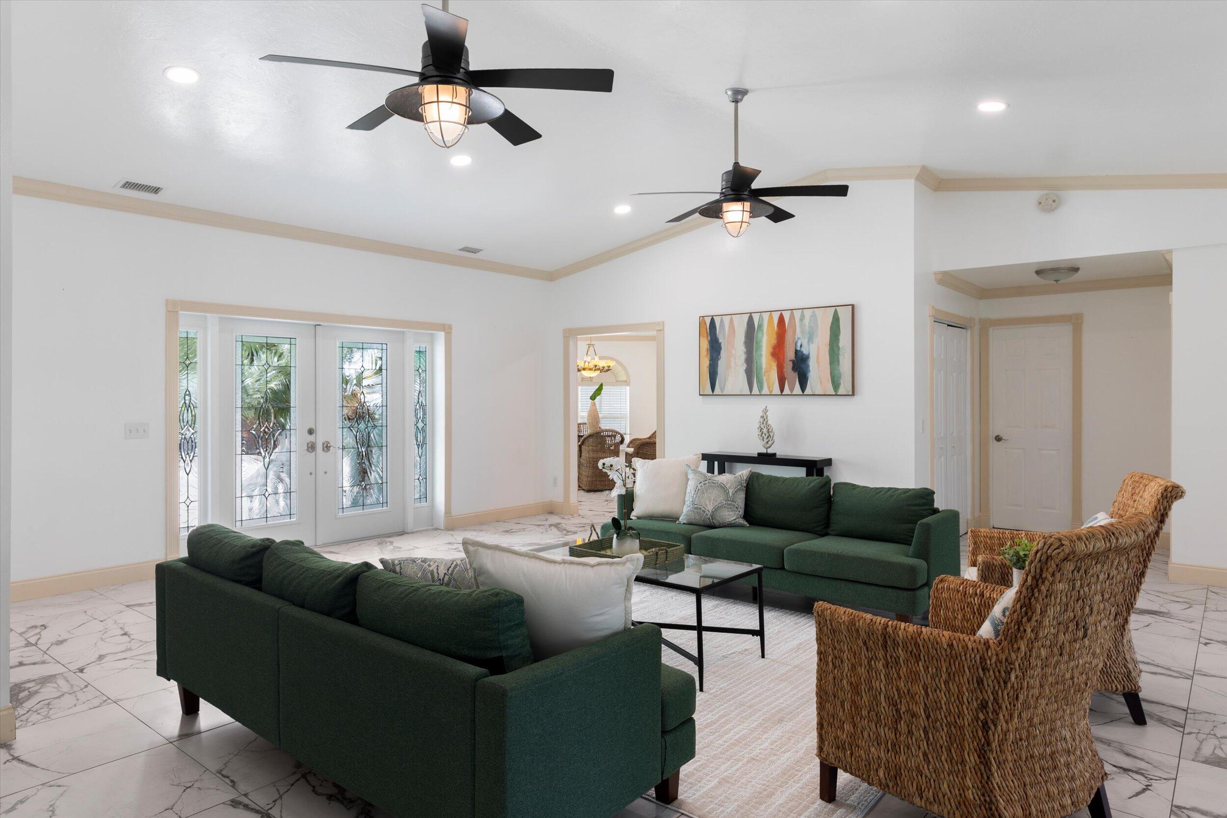 21025 3rd Avenue Cudjoe, FL 33042 - Photo 4 of 43 a living room with furniture ceiling fan and a window