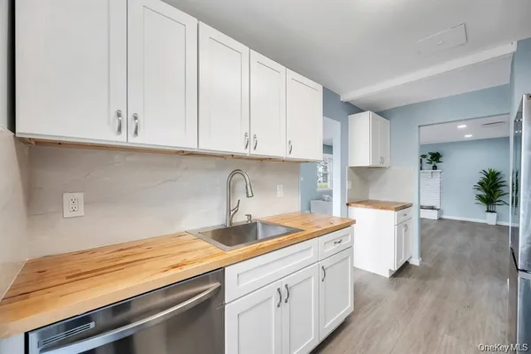 a kitchen with a sink and cabinets
