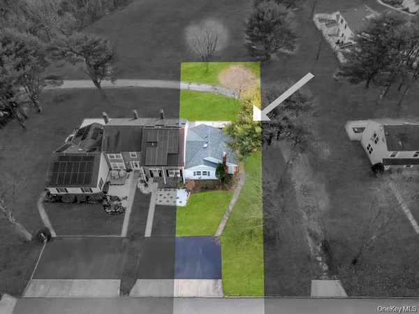 an aerial view of multiple houses with outdoor space