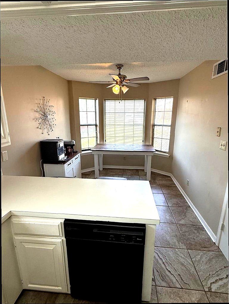 76 Club Road Dover, AR 72837 - Photo 7 of 36 Kitchen with a peninsula, dishwasher, light countertops, white cabinets, and a ceiling fan