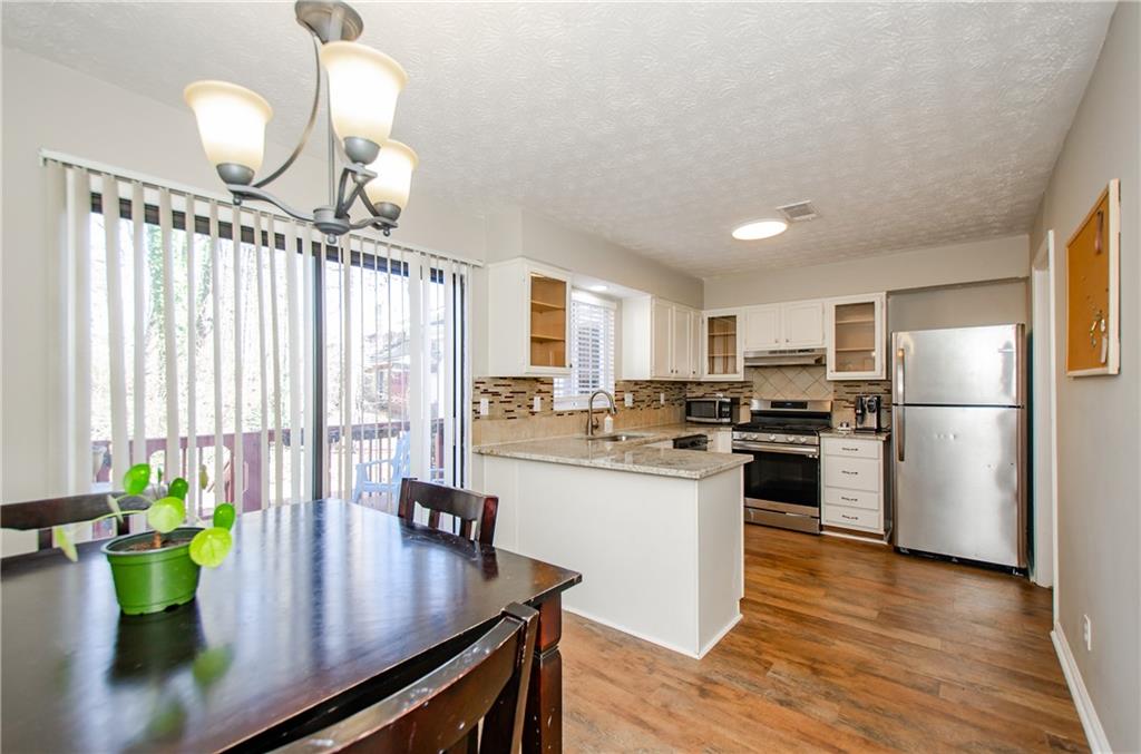 1066 Wedgewood Lane Tucker, GA 30084 - Photo 15 of 23 a kitchen with refrigerator and stove