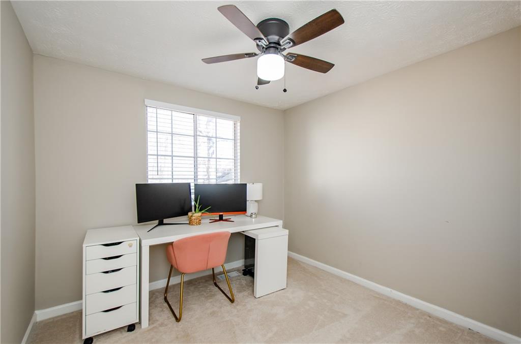 1066 Wedgewood Lane Tucker, GA 30084 - Photo 17 of 23 a view of a workspace with furniture and a window
