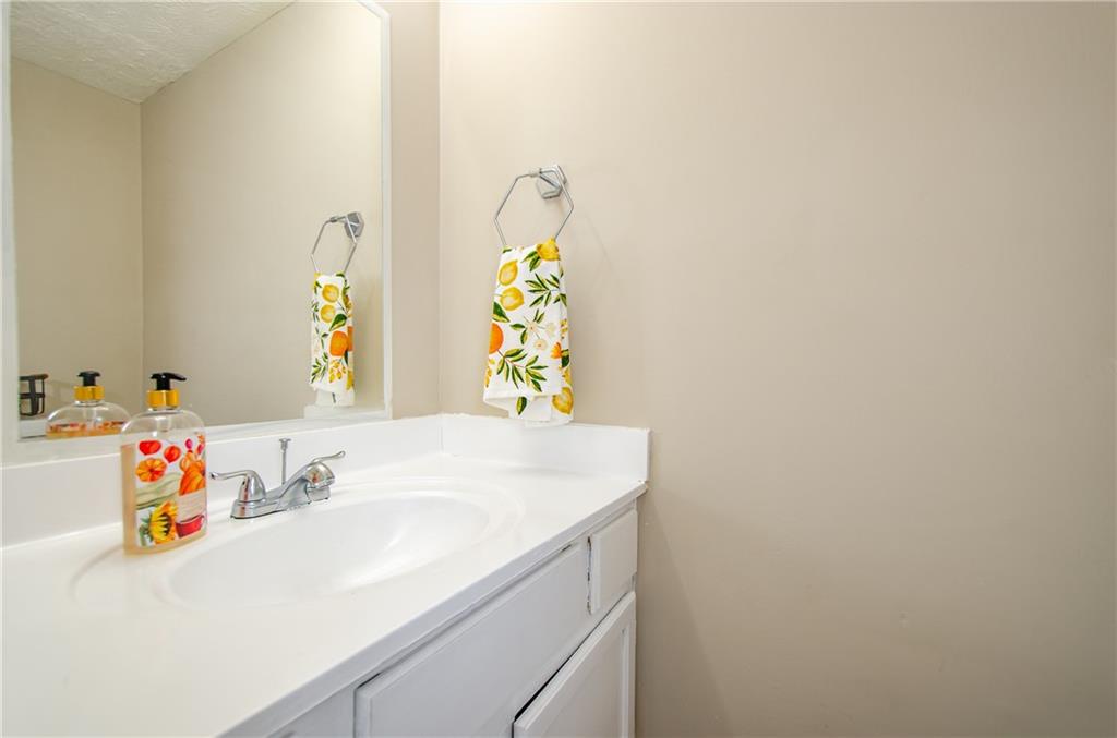 1066 Wedgewood Lane Tucker, GA 30084 - Photo 18 of 23 a bathroom with a sink and a mirror