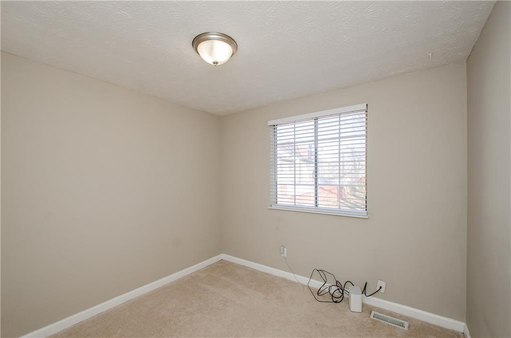 1066 Wedgewood Lane Tucker, GA 30084 - Photo 19 of 23 an empty room with a window