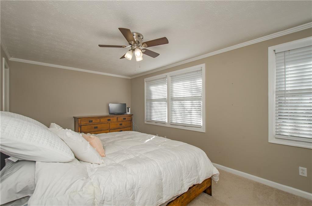 1066 Wedgewood Lane Tucker, GA 30084 - Photo 22 of 23 a bedroom with a bed and window