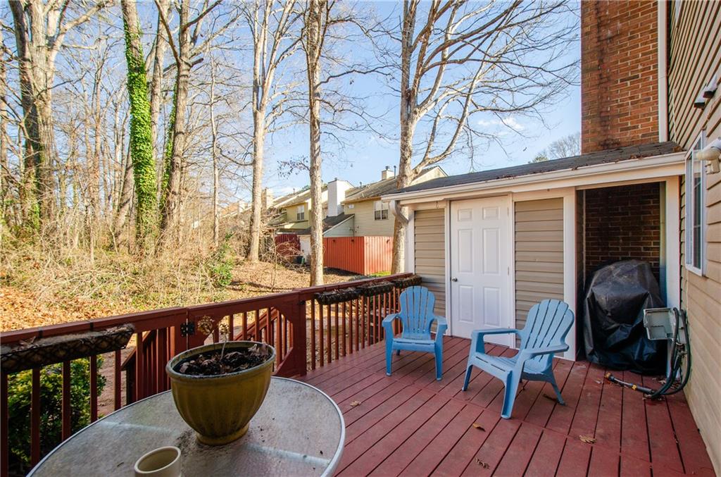 1066 Wedgewood Lane Tucker, GA 30084 - Photo 5 of 23 a view of a deck with furniture and wooden floor
