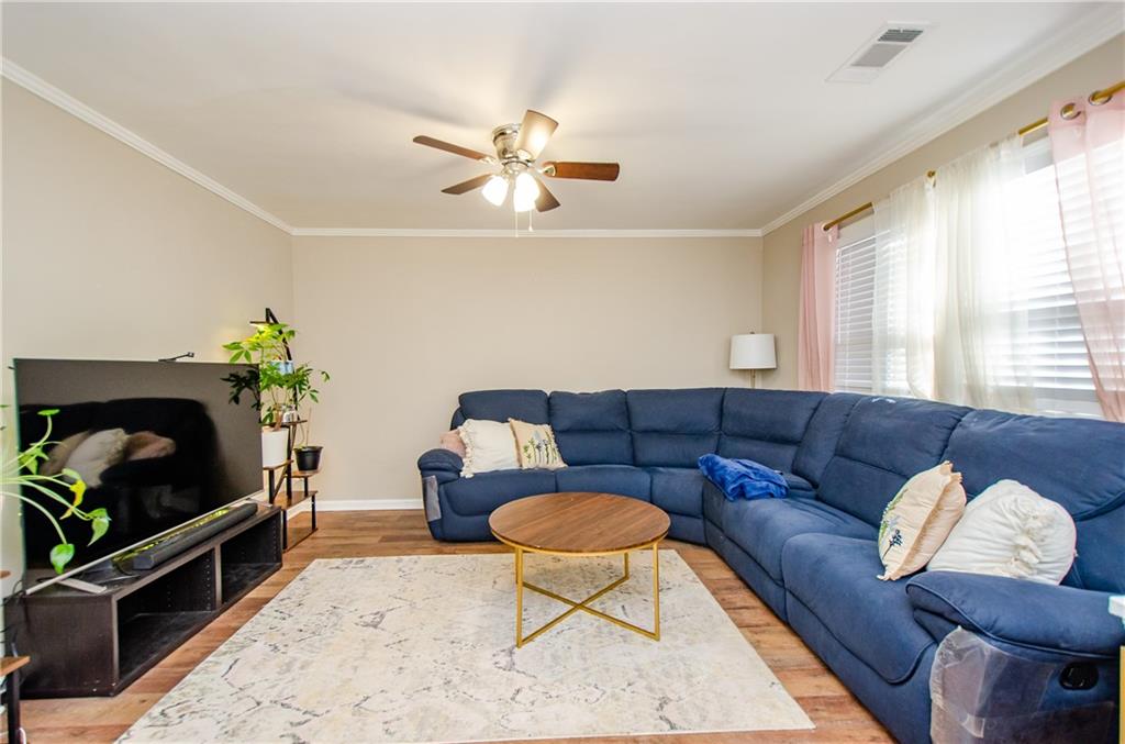 1066 Wedgewood Lane Tucker, GA 30084 - Photo 9 of 23 a living room with furniture and a potted plant