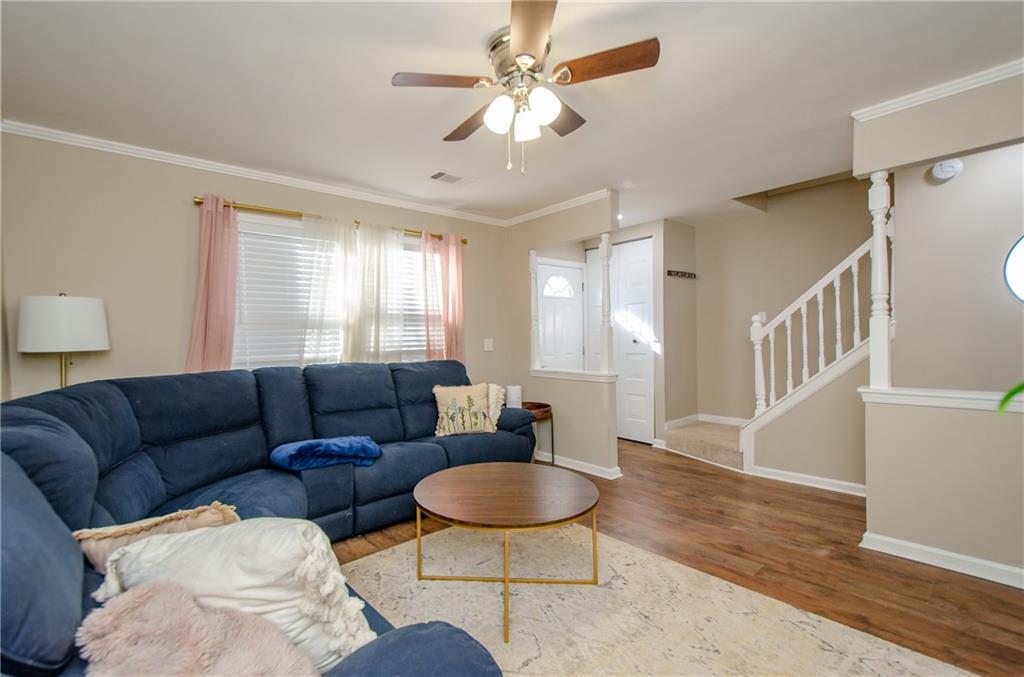1066 Wedgewood Lane Tucker, GA 30084 - Photo 10 of 23 a living room with furniture a table and a chandelier