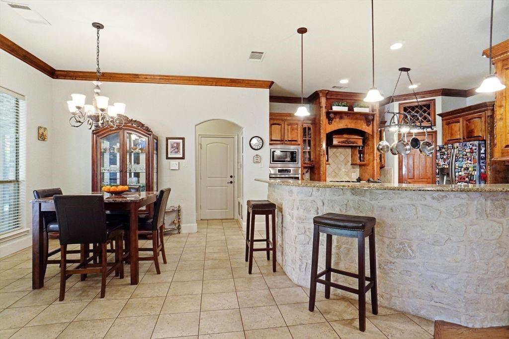 620 Highview Lane Hurst, TX 76054 - Photo 18 of 40 a view of a dining room with furniture